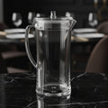 Clear glass pitcher on a white background