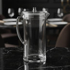 Clear glass pitcher on a white background