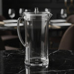 Clear glass pitcher on a white background